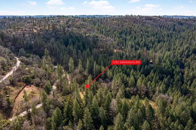 a view of a houses with a park