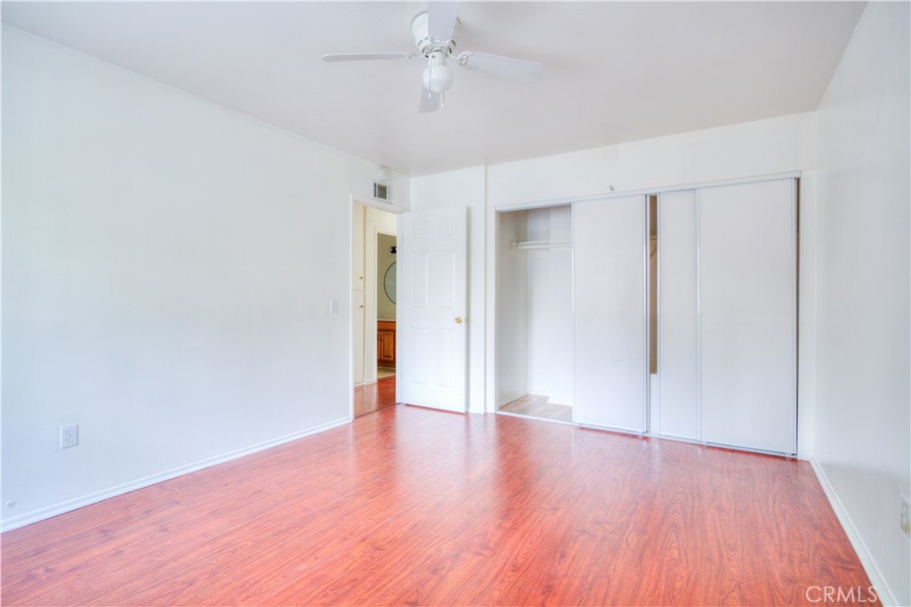 4853 Jackson Street, Unit C Riverside, CA 92503 - Photo 20 of 26 a view of an empty room with wooden floor