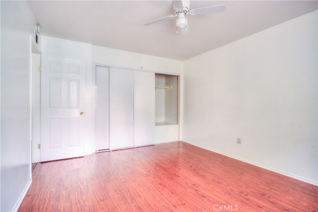 4853 Jackson Street, Unit C Riverside, CA 92503 - Photo 22 of 26 a view of an empty room with wooden floor