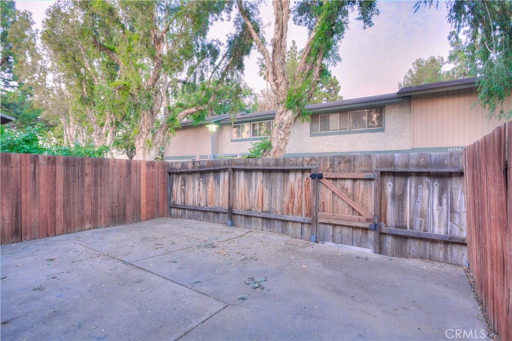 4853 Jackson Street, Unit C Riverside, CA 92503 - Photo 3 of 26 front view of a house with a wooden fence