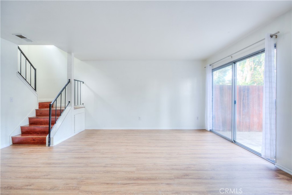 4853 Jackson Street, Unit C Riverside, CA 92503 - Photo 6 of 26 a view of entryway and hall with wooden floor
