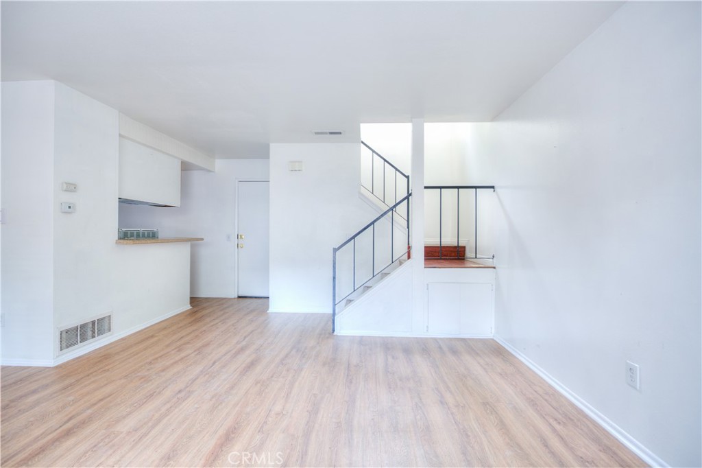 4853 Jackson Street, Unit C Riverside, CA 92503 - Photo 8 of 26 a view of entryway with stairs and wooden floor