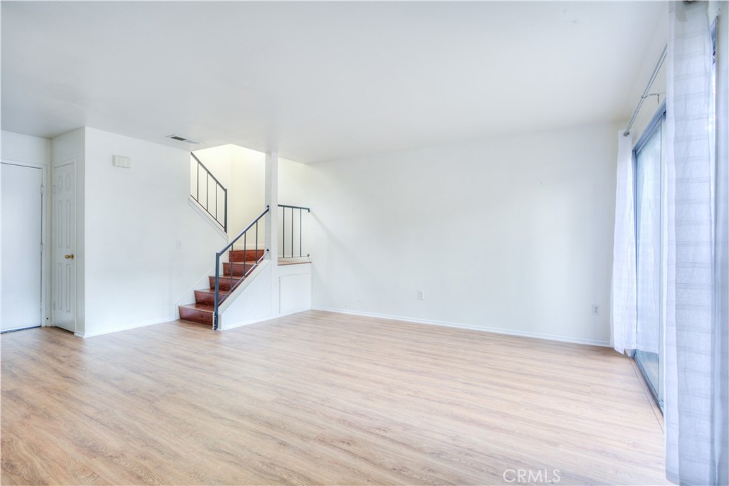 4853 Jackson Street, Unit C Riverside, CA 92503 - Photo 9 of 26 a view of an empty room with wooden floor