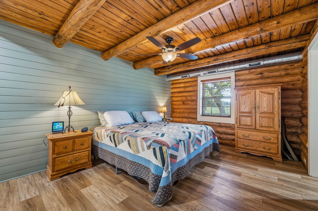 348 Blau Lane Hext, TX 76848 - Photo 22 of 94 a bed sitting in a bedroom next to a window
