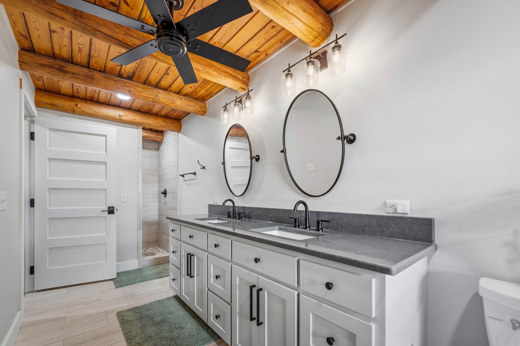 348 Blau Lane Hext, TX 76848 - Photo 23 of 94 a bathroom with a granite countertop double vanity sink and a mirror