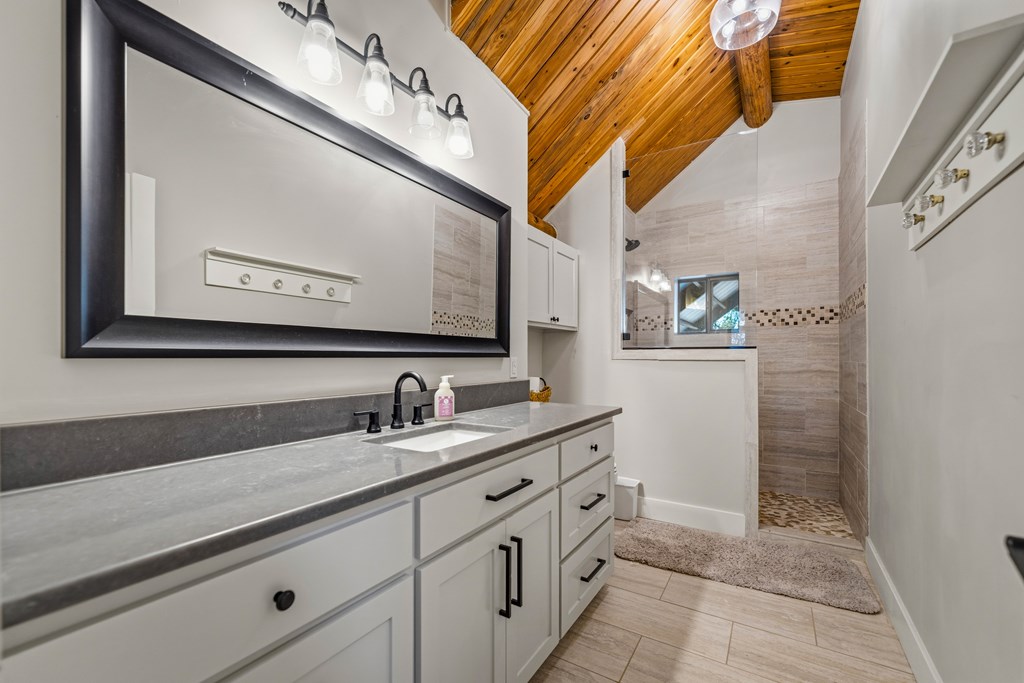 348 Blau Lane Hext, TX 76848 - Photo 27 of 94 a bathroom with a sink and a mirror