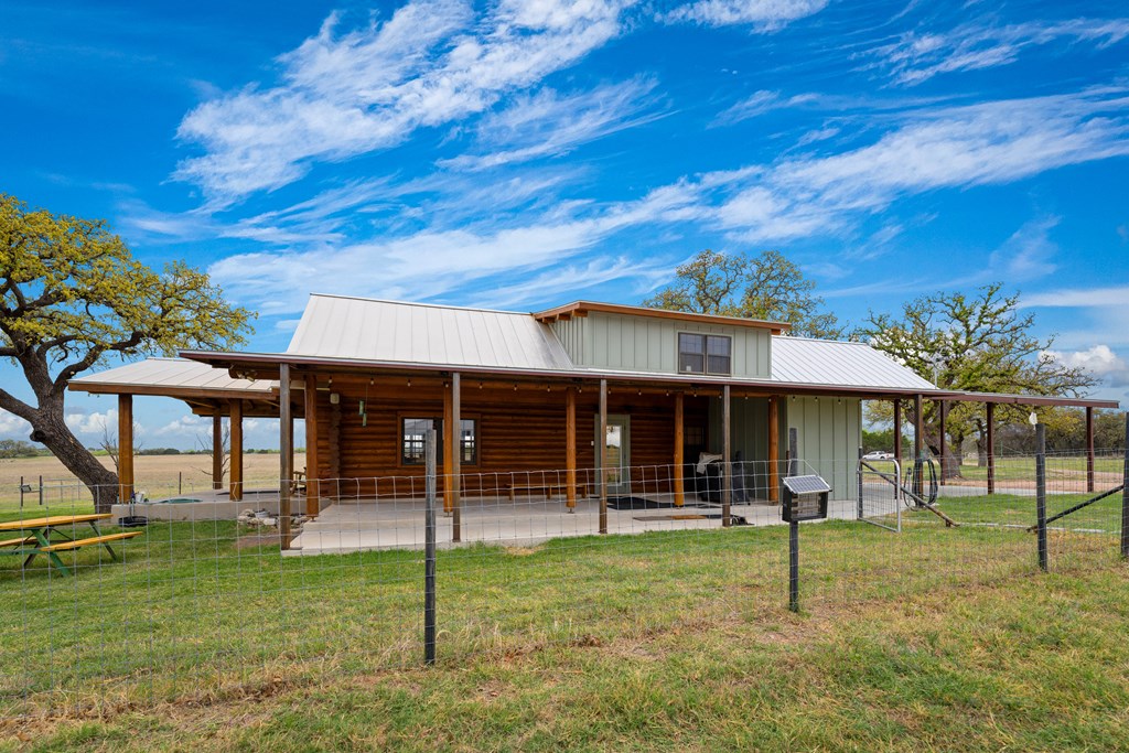 348 Blau Lane Hext, TX 76848 - Photo 55 of 94 a view of a house with a backyard porch and sitting area