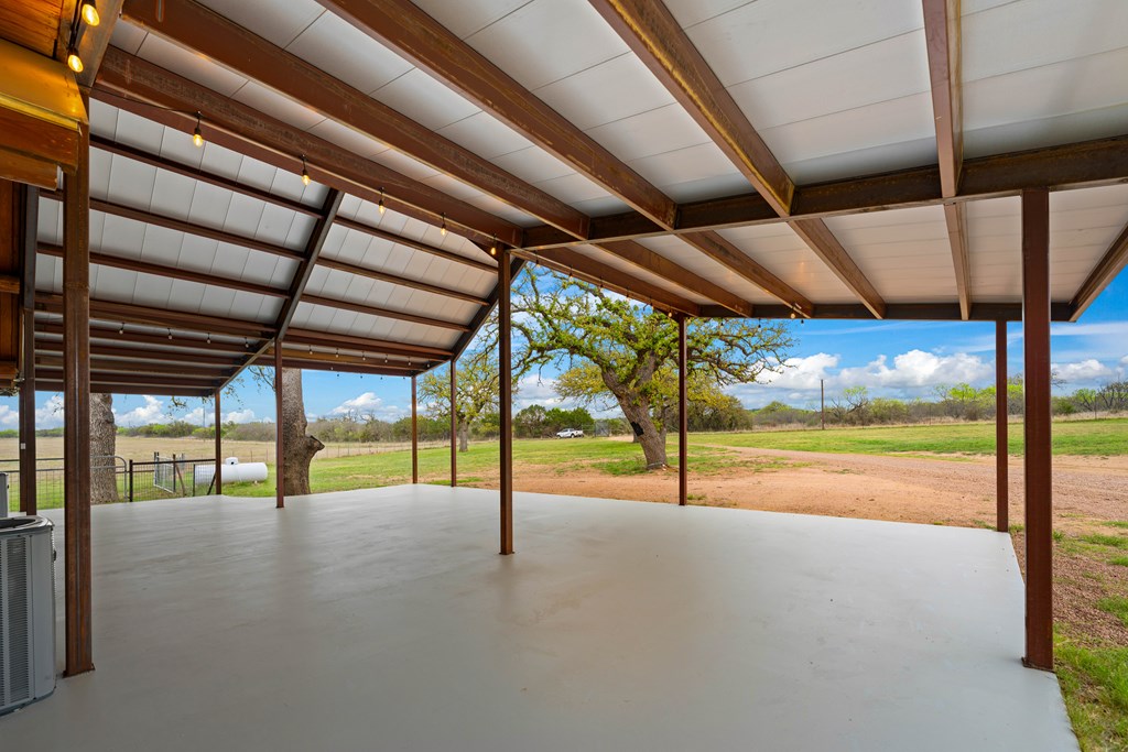 348 Blau Lane Hext, TX 76848 - Photo 63 of 94 a view of a swimming pool with a porch