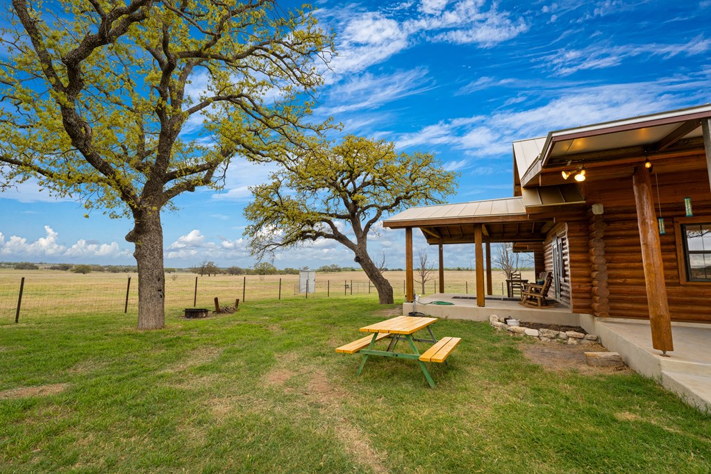 348 Blau Lane Hext, TX 76848 - Photo 65 of 94 a view of a backyard with a garden