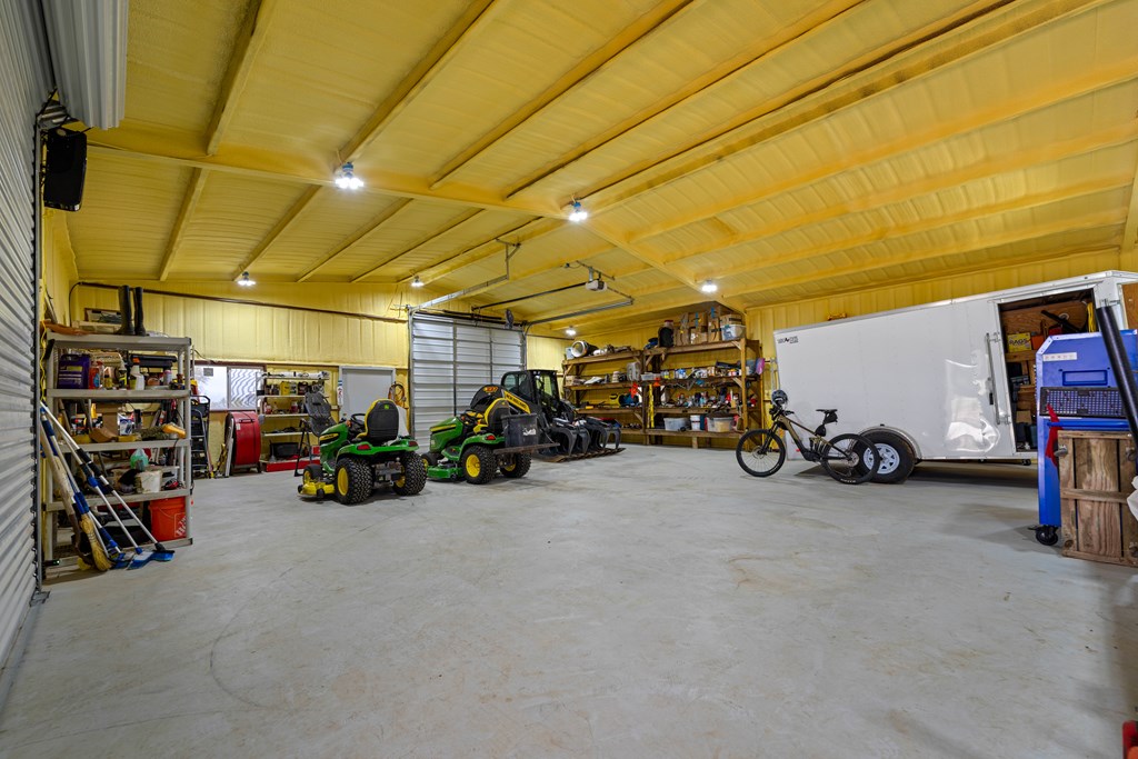 348 Blau Lane Hext, TX 76848 - Photo 75 of 94 a view of a garage with a bike and car