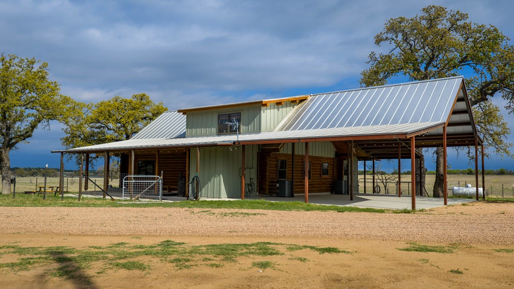 348 Blau Lane Hext, TX 76848 - Photo 78 of 94 a front view of a house with a garden