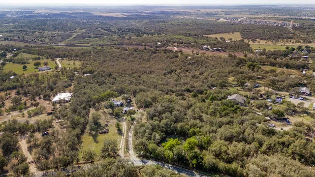 an aerial view of residential house and green space