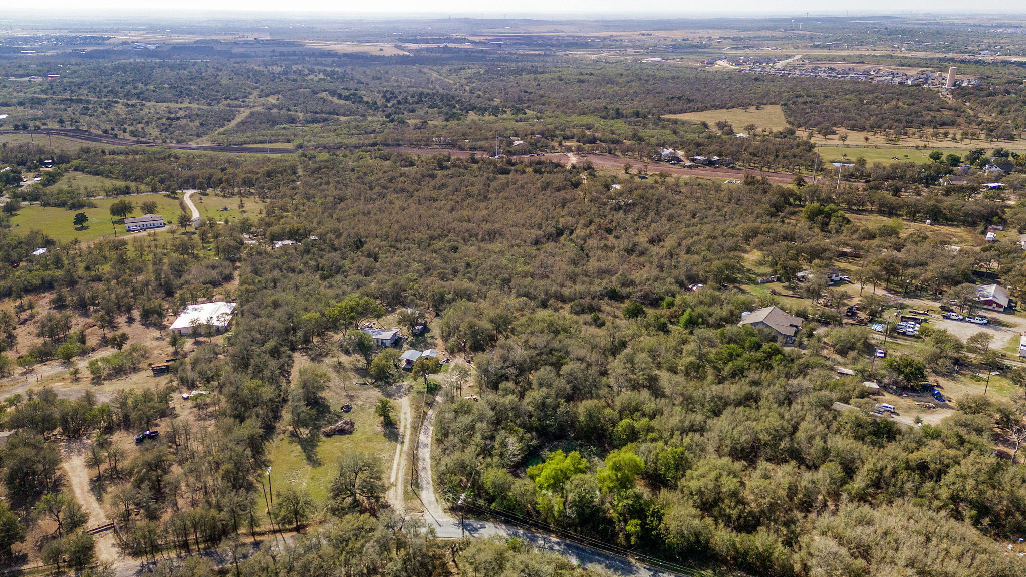 an aerial view of residential house and green space
