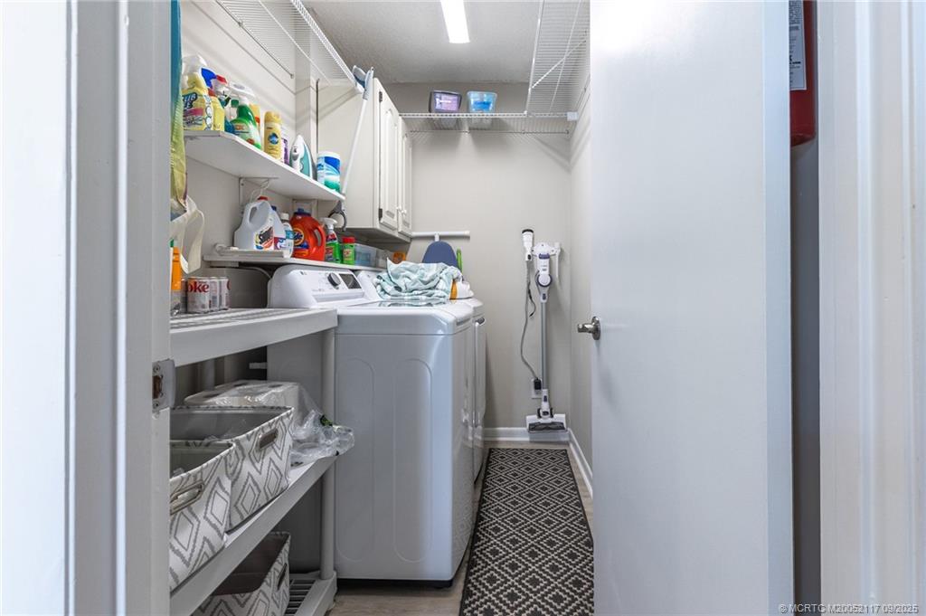 5596 Northeast Gulfstream Way Stuart, FL 34996 - Photo 4 of 21 a room with storage and utility