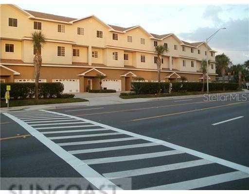 15467 Gulf Boulevard, Unit 8 Madeira Beach, FL 33708 - Photo 1 of 1 a front view of a house with a street