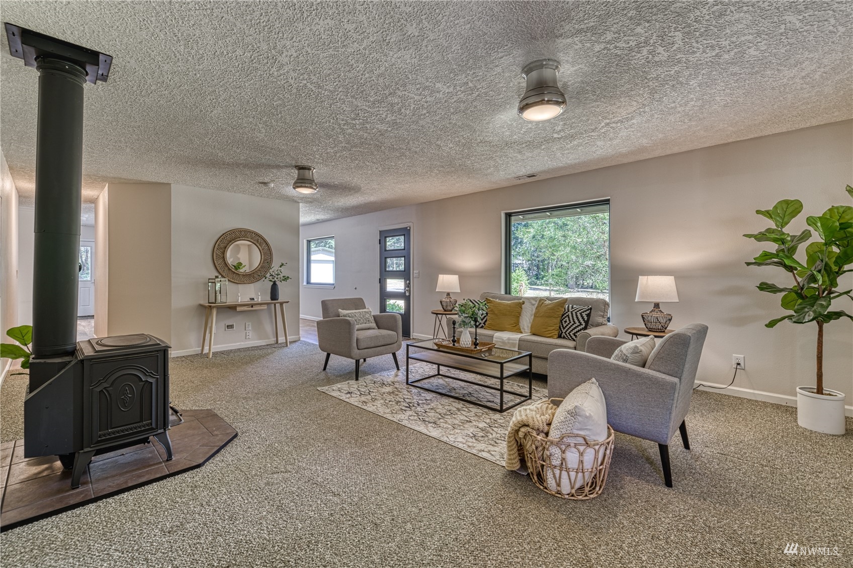 325 Hawkins Road Winlock, WA 98596 - Photo 12 of 40 a living room with furniture a bookshelf and a window