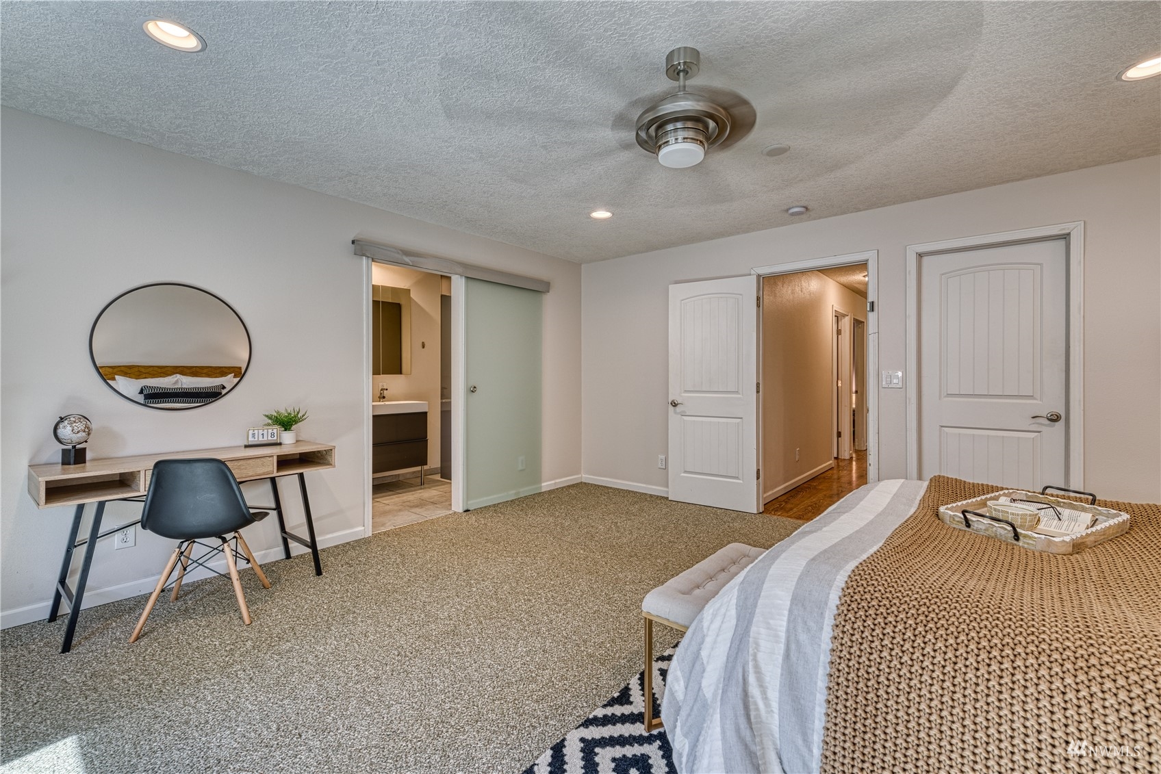 325 Hawkins Road Winlock, WA 98596 - Photo 17 of 40 a bedroom with a bed and a chandelier