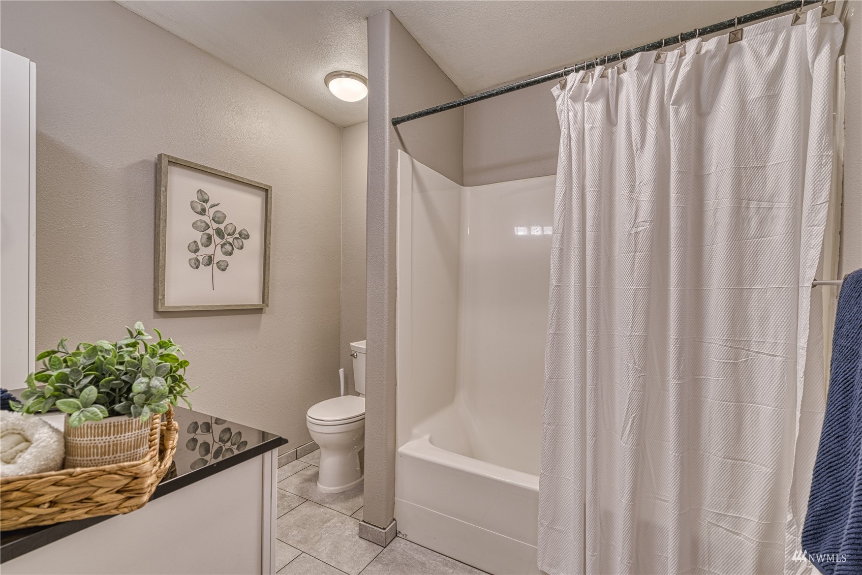 325 Hawkins Road Winlock, WA 98596 - Photo 23 of 40 a bathroom with a granite countertop sink a toilet and a shower