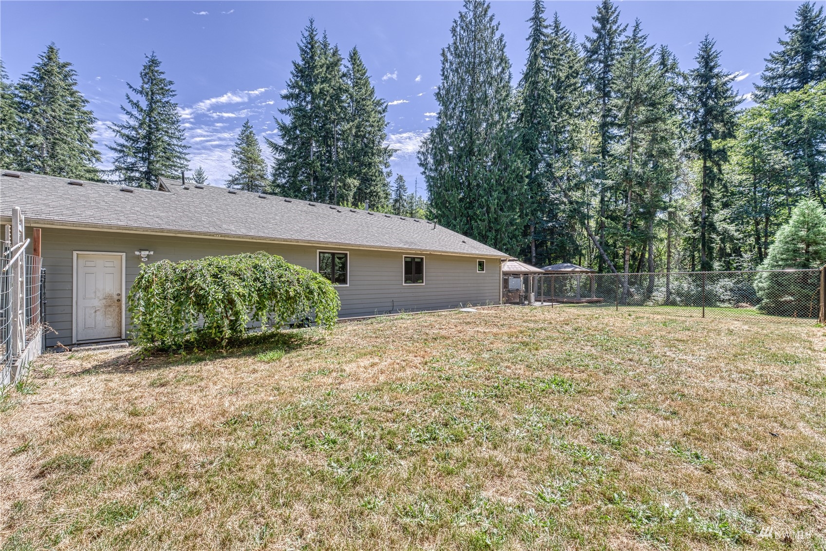 325 Hawkins Road Winlock, WA 98596 - Photo 28 of 40 a backyard of a house with lots of green space