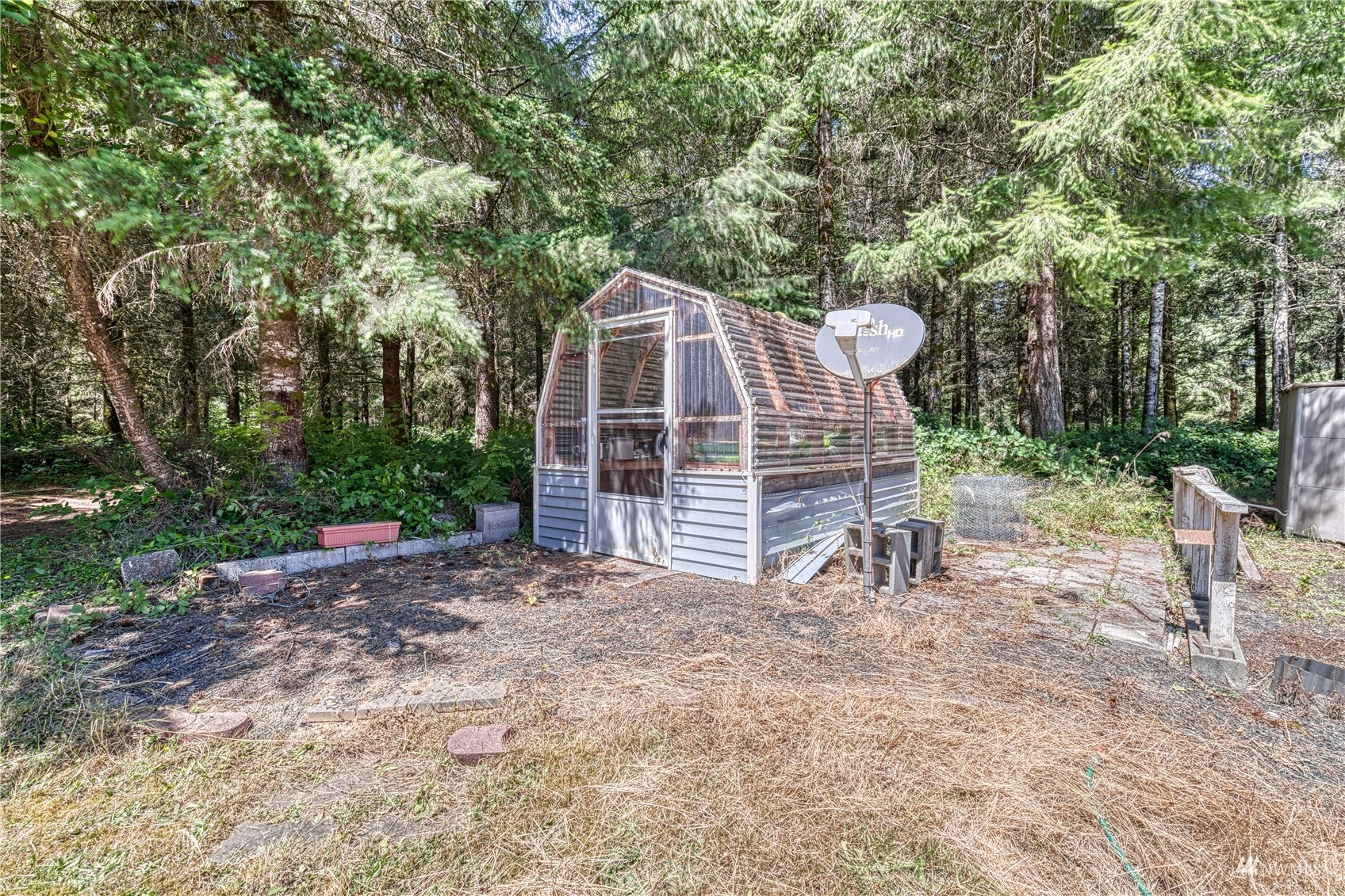 325 Hawkins Road Winlock, WA 98596 - Photo 38 of 40 a view of a tiny house with a yard and sitting area