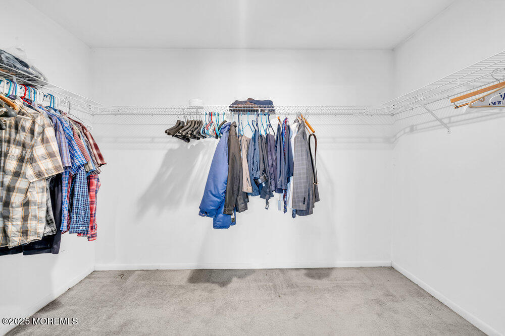 896 Anderson Road Jackson, NJ 08527 - Photo 15 of 21 a view of walk in closet with clothes and shoes