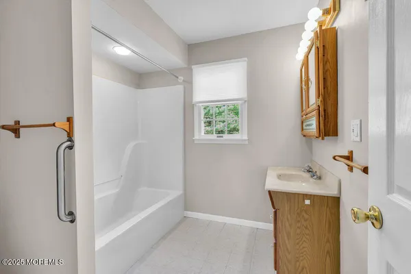 a bathroom with a sink a vanity and a mirror
