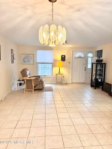 a view of a livingroom with furniture and window