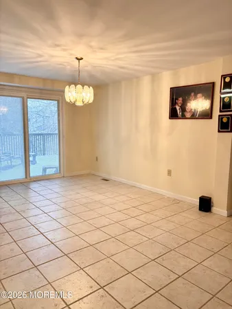 a kitchen with stainless steel appliances kitchen island granite countertop a sink a stove a counter space and cabinets