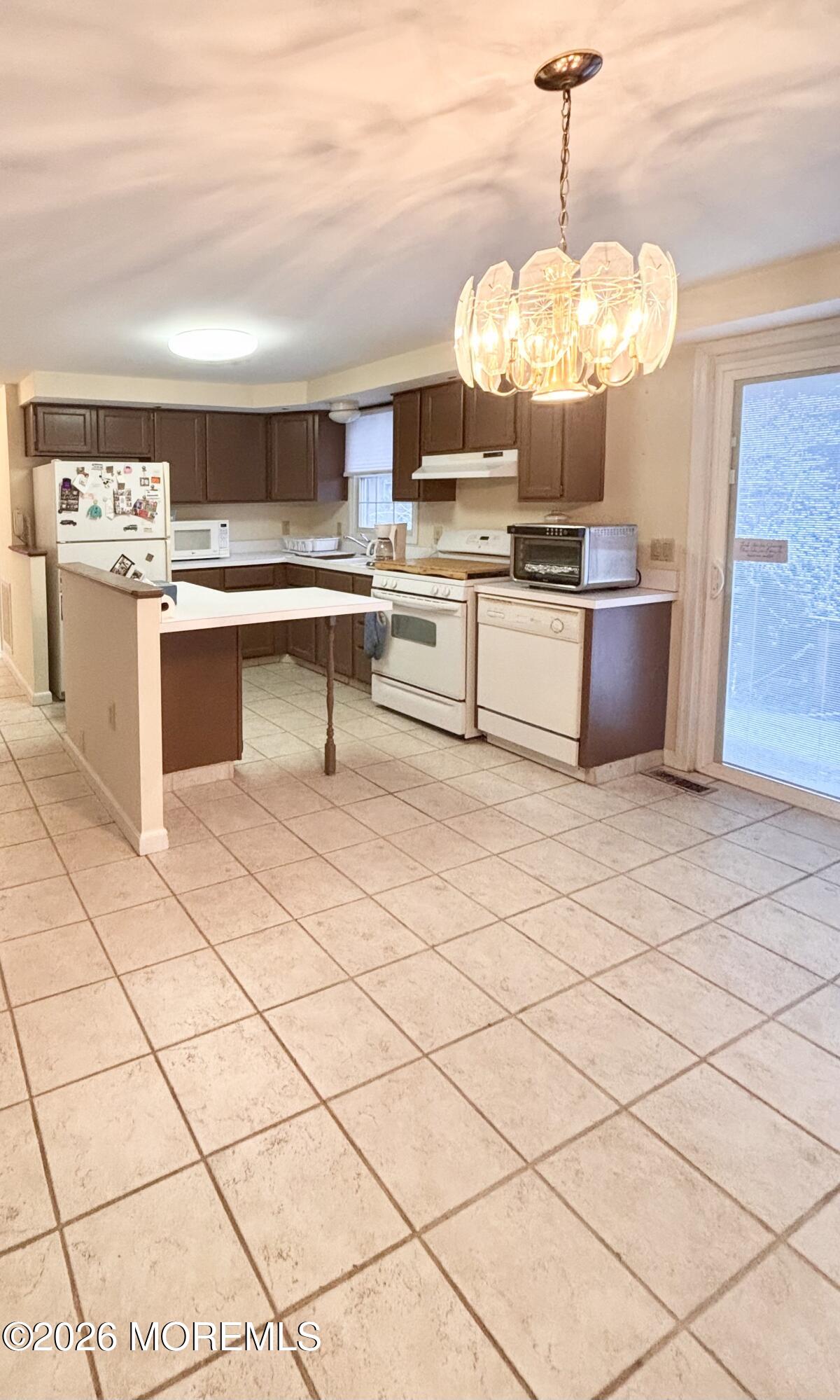 896 Anderson Road Jackson, NJ 08527 - Photo 8 of 21 a kitchen with stainless steel appliances kitchen island granite countertop a sink a stove a counter space and cabinets