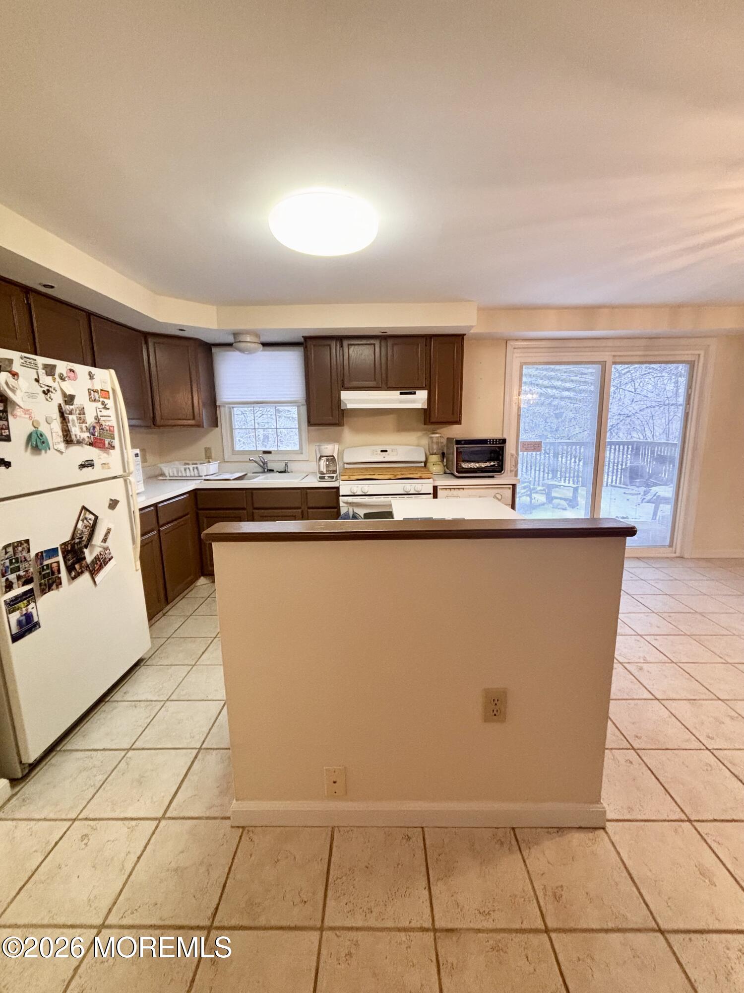 896 Anderson Road Jackson, NJ 08527 - Photo 9 of 21 a kitchen with stainless steel appliances a sink a stove a microwave a counter top space and cabinets