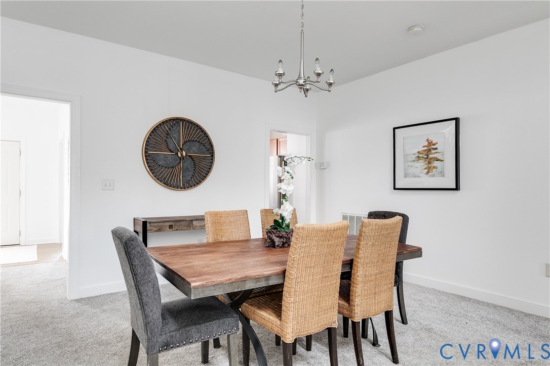 2209 Magnolia Grove Way Midlothian, VA 23113 - Photo 19 of 50 a dining room with furniture and a mirror