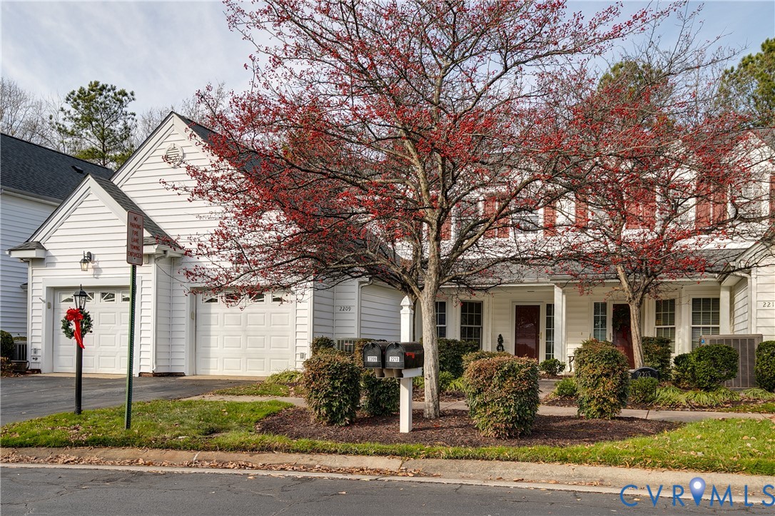 2209 Magnolia Grove Way Midlothian, VA 23113 - Photo 2 of 50 a front view of a house with garden