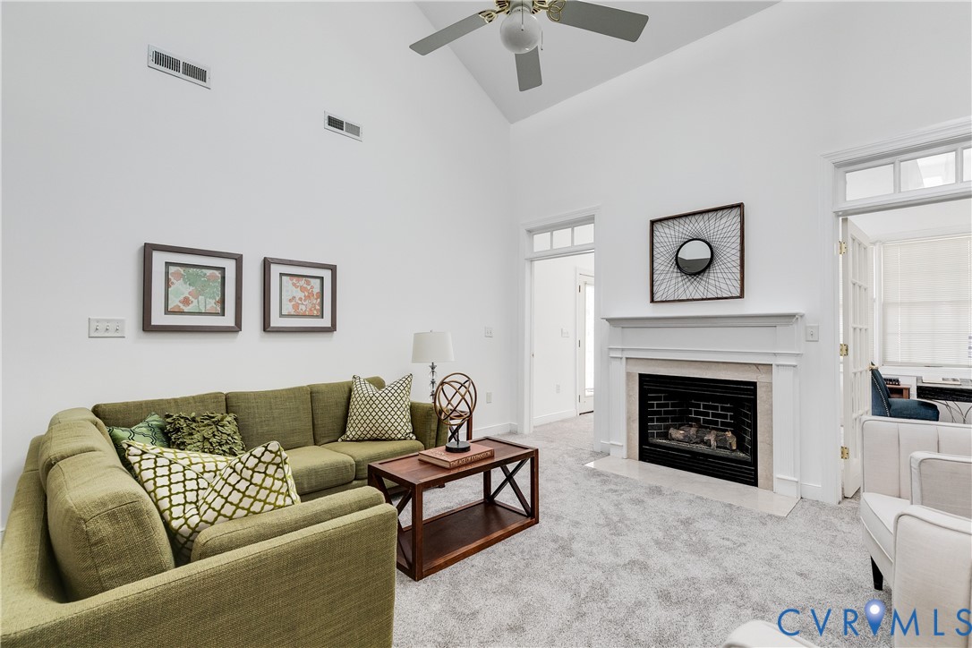2209 Magnolia Grove Way Midlothian, VA 23113 - Photo 21 of 50 a living room with furniture and a fireplace