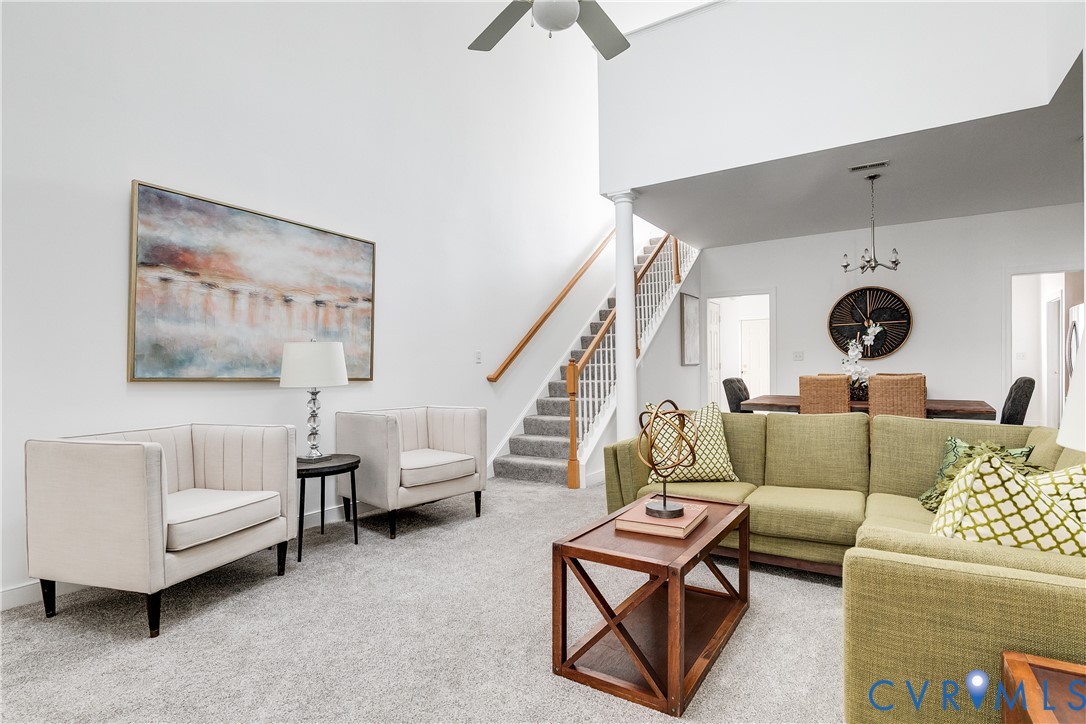 2209 Magnolia Grove Way Midlothian, VA 23113 - Photo 25 of 50 a living room with furniture and a clock