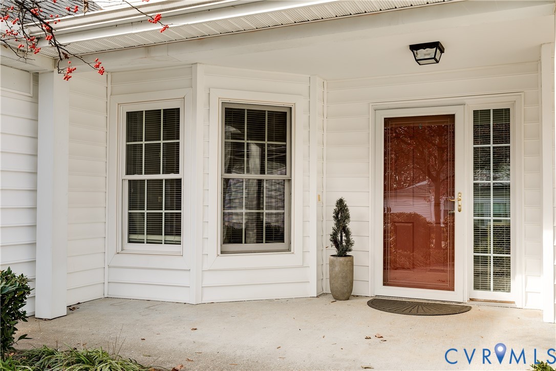 2209 Magnolia Grove Way Midlothian, VA 23113 - Photo 3 of 50 a view of a brick house with a large window