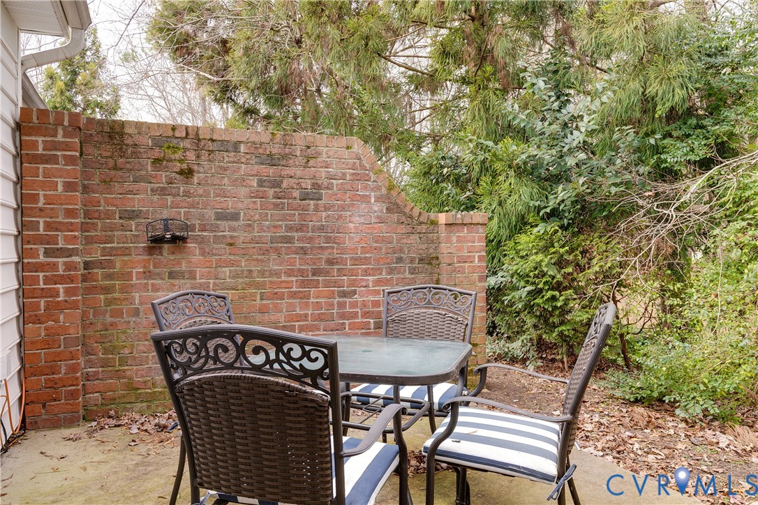 2209 Magnolia Grove Way Midlothian, VA 23113 - Photo 31 of 50 a backyard of a house with table and chairs