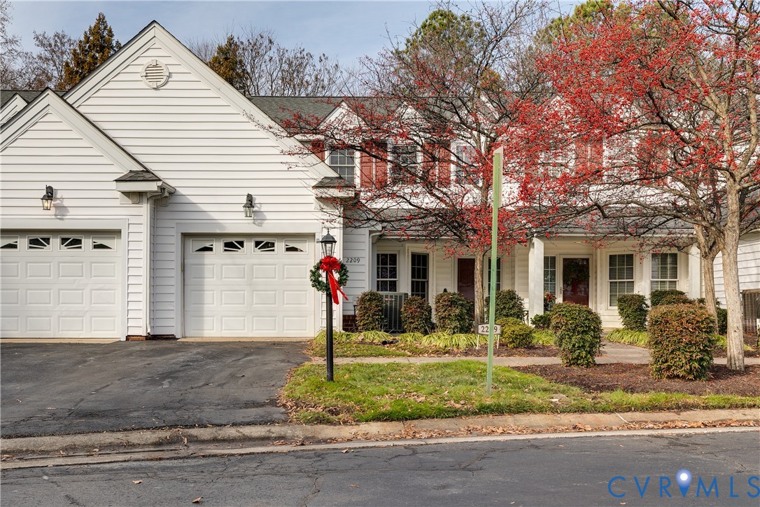 2209 Magnolia Grove Way Midlothian, VA 23113 - Photo 50 of 50 a front view of a house with garden