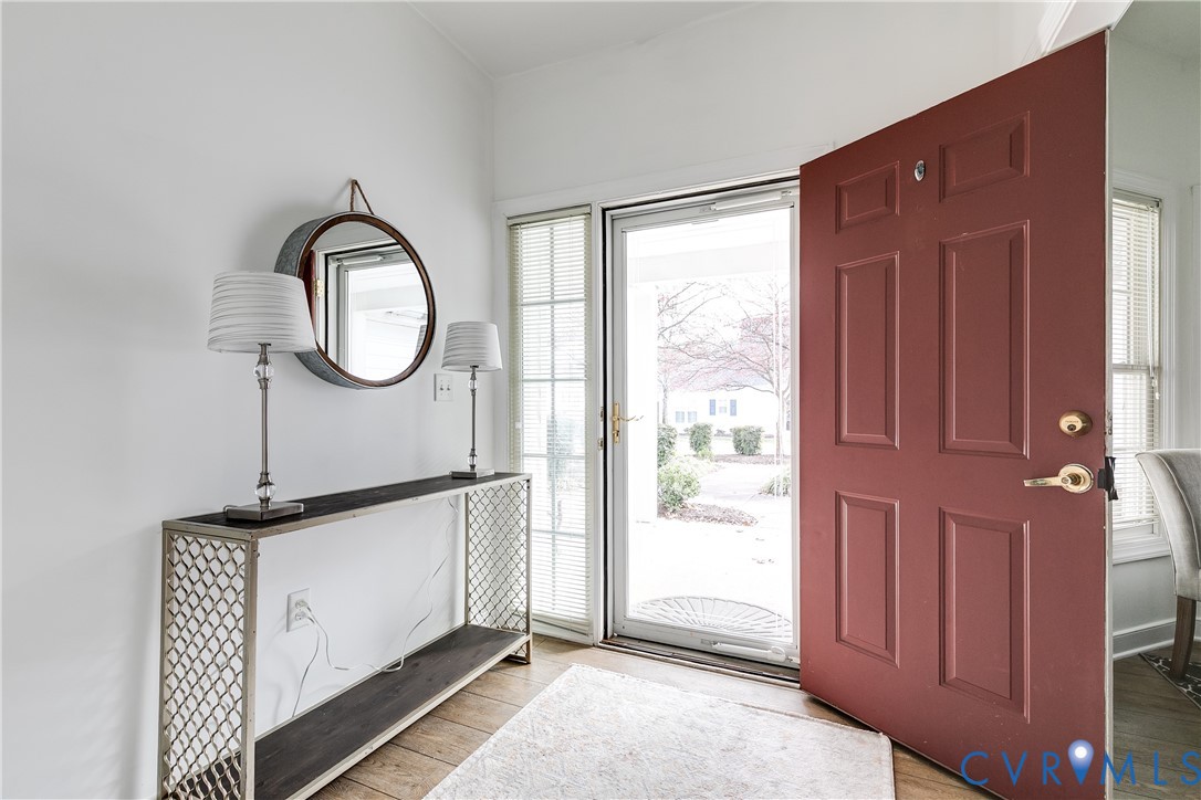 2209 Magnolia Grove Way Midlothian, VA 23113 - Photo 6 of 50 a view of a livingroom with wooden floor and white walls