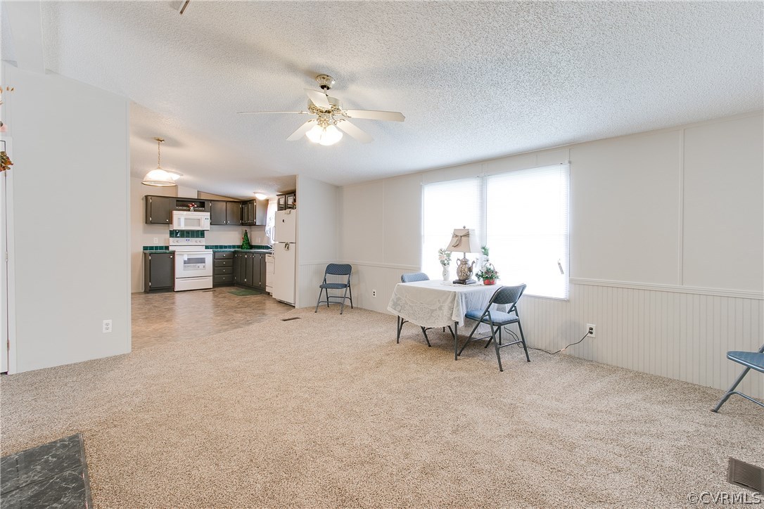 3464 Cedar Plains Road Sandy Hook, VA 23153 - Photo 17 of 43 a living room with furniture and kitchen view