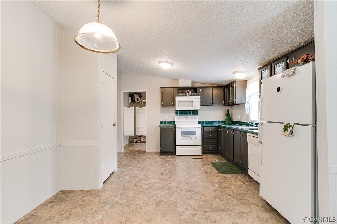 3464 Cedar Plains Road Sandy Hook, VA 23153 - Photo 22 of 43 a kitchen with refrigerator and cabinets