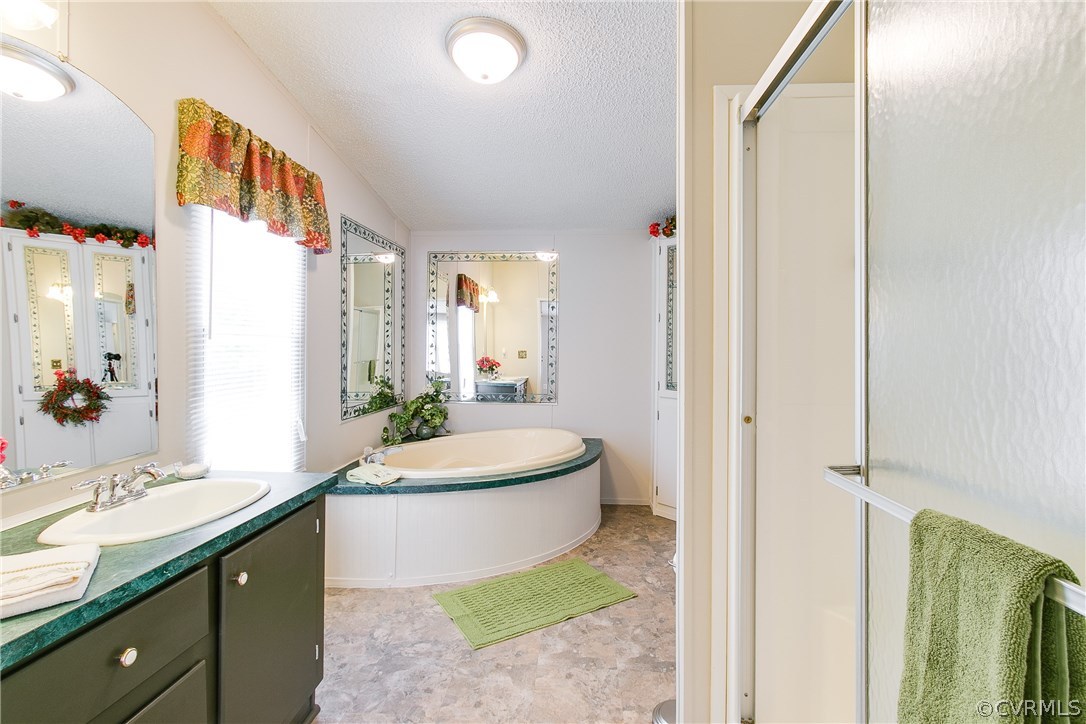 3464 Cedar Plains Road Sandy Hook, VA 23153 - Photo 27 of 43 a spacious bathroom with a double vanity sink and a mirror
