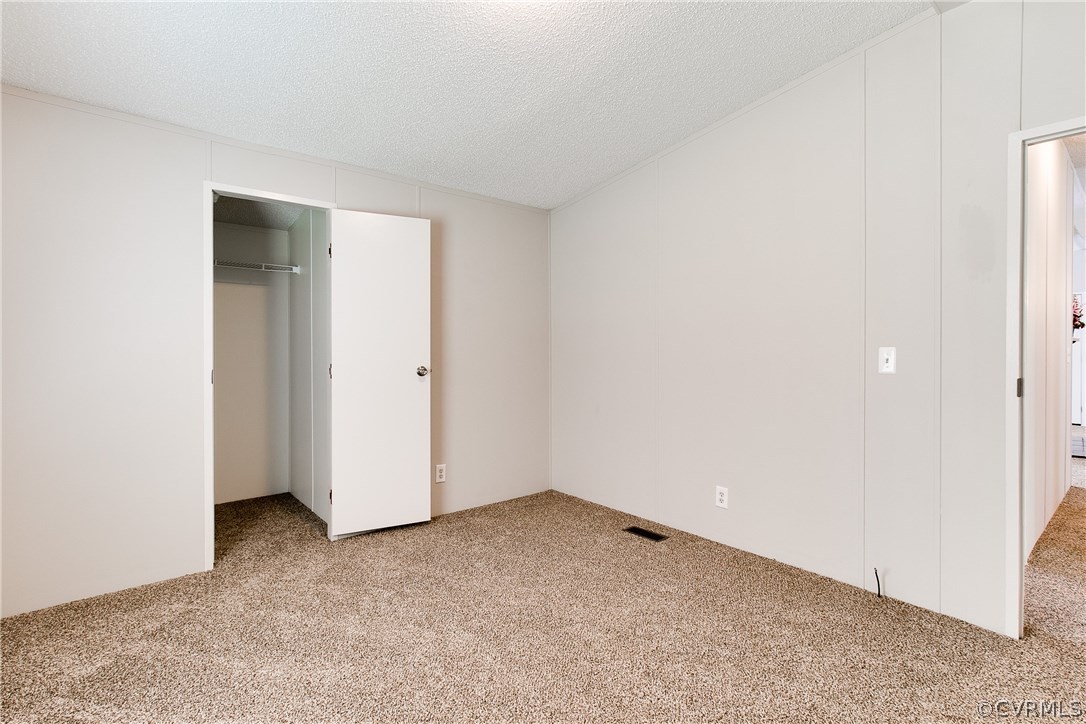 3464 Cedar Plains Road Sandy Hook, VA 23153 - Photo 31 of 43 an empty room with closet
