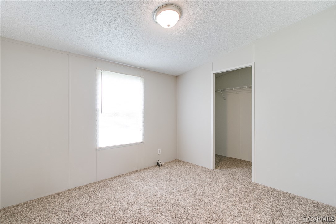 3464 Cedar Plains Road Sandy Hook, VA 23153 - Photo 35 of 43 an empty room with a window
