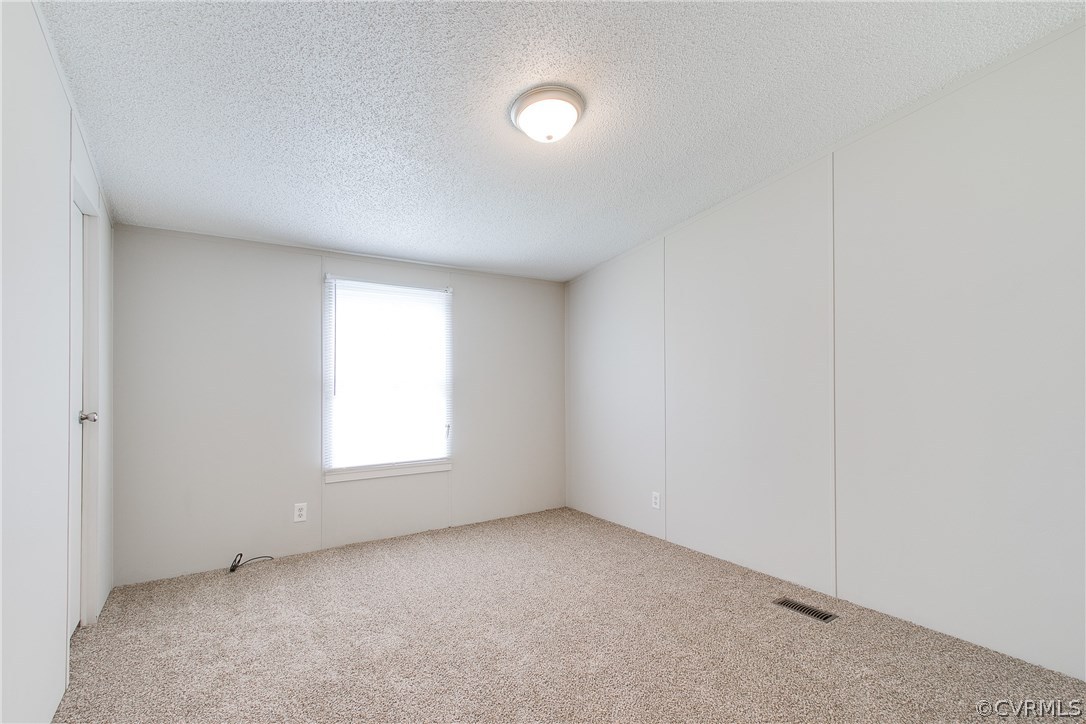 3464 Cedar Plains Road Sandy Hook, VA 23153 - Photo 37 of 43 an empty room with windows and window