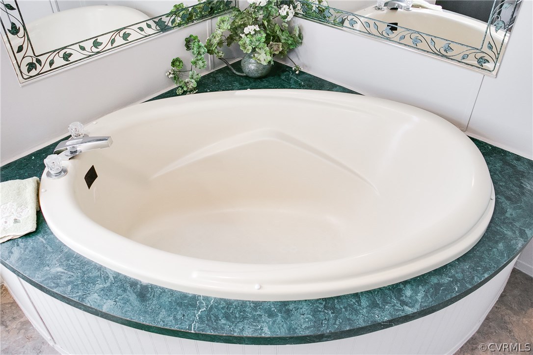 3464 Cedar Plains Road Sandy Hook, VA 23153 - Photo 40 of 43 a white bath tub sitting in a bathroom