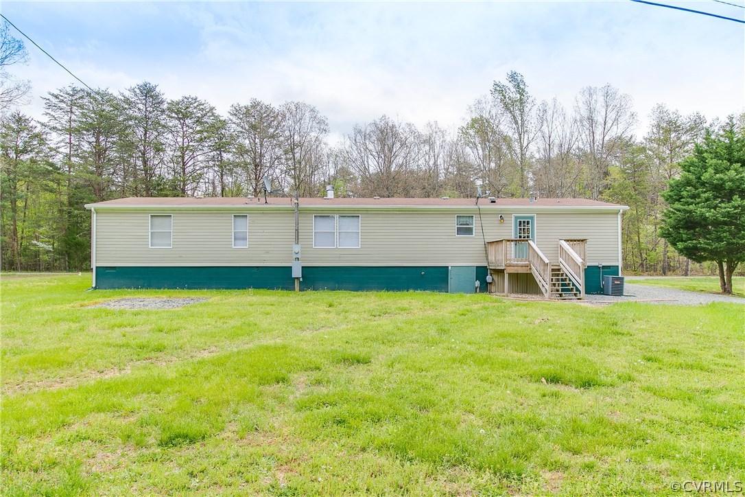 3464 Cedar Plains Road Sandy Hook, VA 23153 - Photo 43 of 43 a view of a house with a yard and sitting area