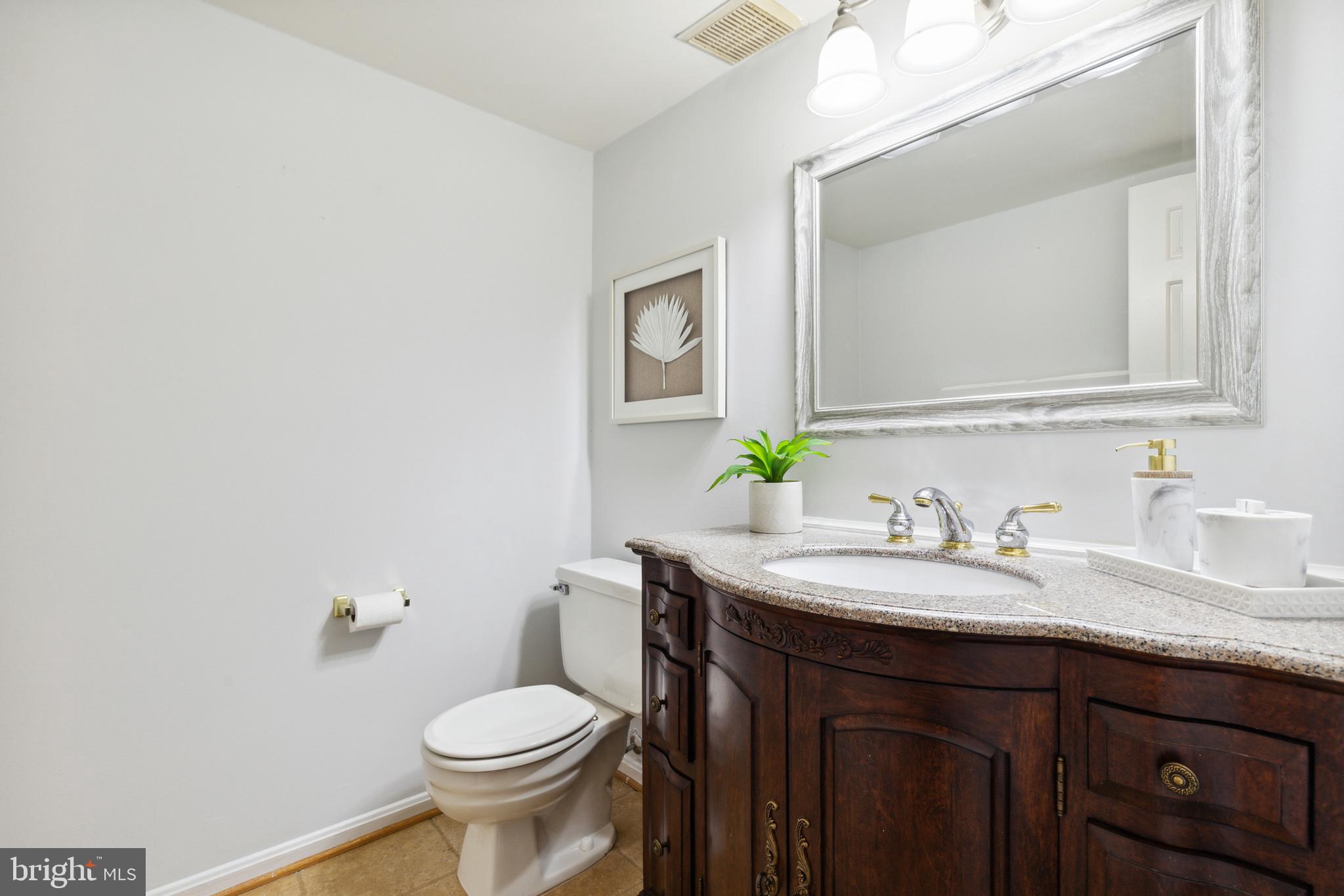 5124 Pheasant Ridge Road Fairfax, VA 22030 - Photo 9 of 53 Updated half bath on main level