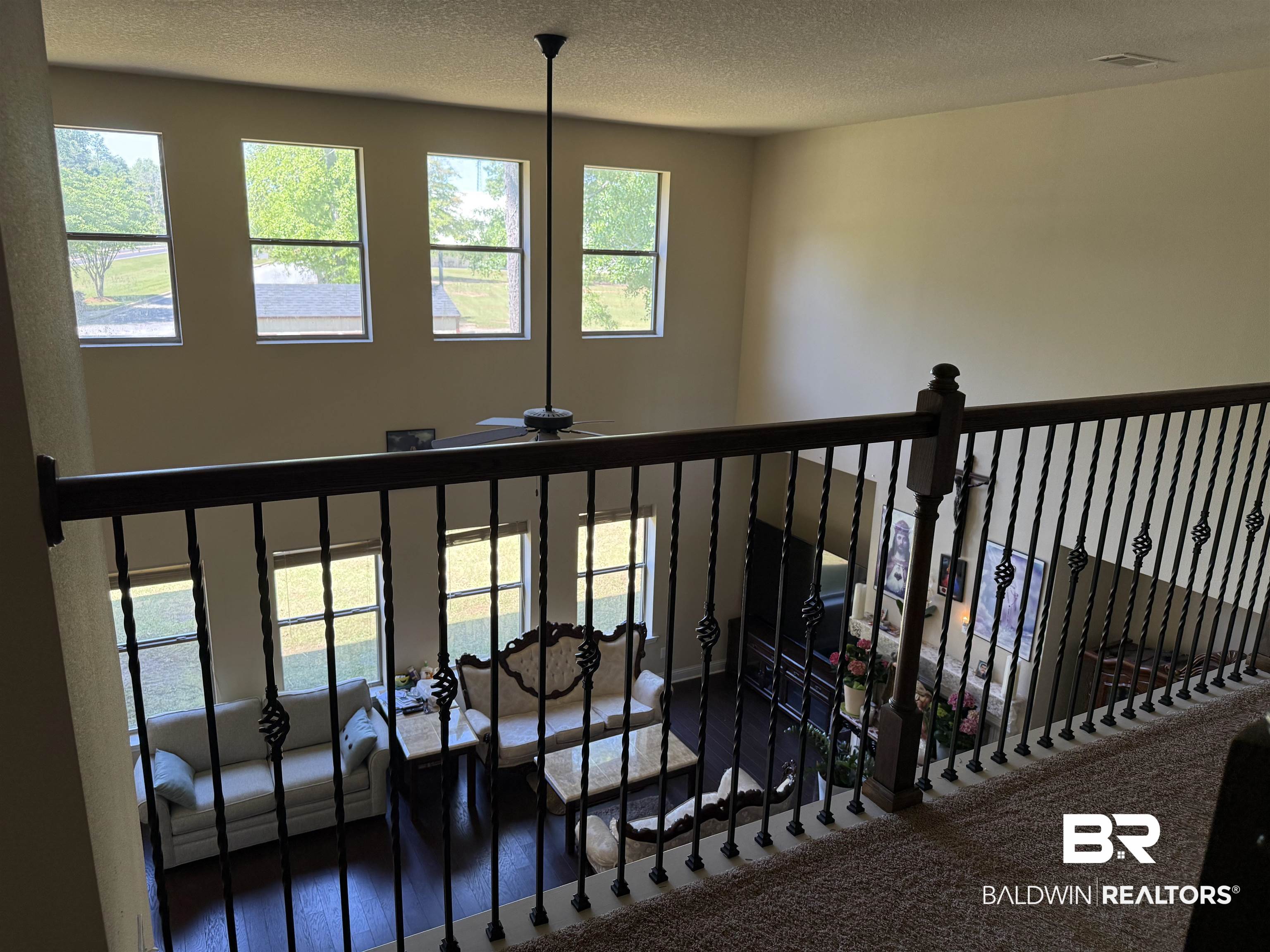 9023 Krystal Ridge Court Daphne, AL 36526 - Photo 25 of 41 Staircase featuring plenty of natural light, a textured ceiling, ceiling fan, and carpet floors