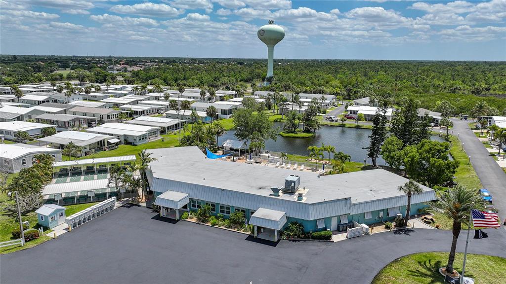 10303 Burnt Store Road, Unit 143 Punta Gorda, FL 33950 - Photo 38 of 42 an aerial view of a house with a garden and lake view