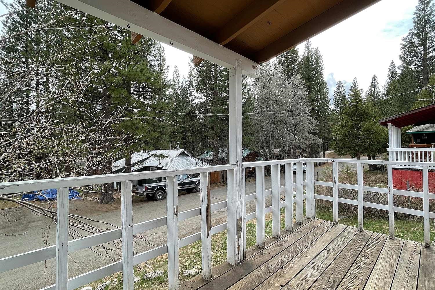 318 Coates Avenue Calpine, CA 96124 - Photo 2 of 21 a view of a wooden chairs and table in the balcony